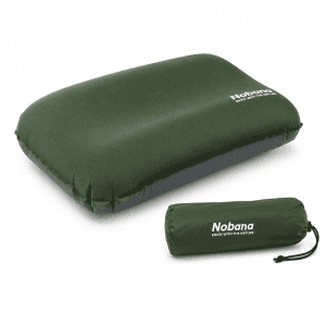 Self-inflating camping pillow with storage bag